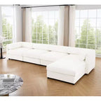 Canapé modulable avec rangement, dossier cylindrique et accoudoirs, assise profonde et confortable, durable et offrant un bon soutien pour le salon.